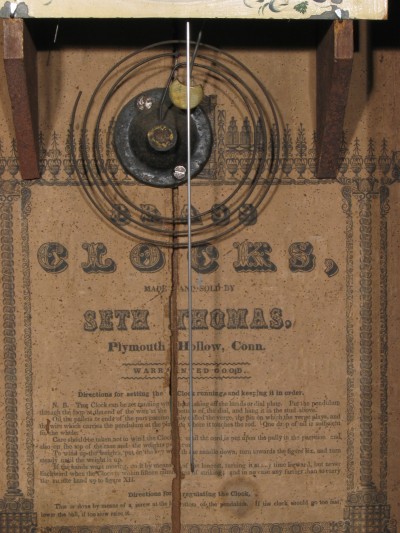 Label, gong and hammer. Early style, crescent shaped hammer.