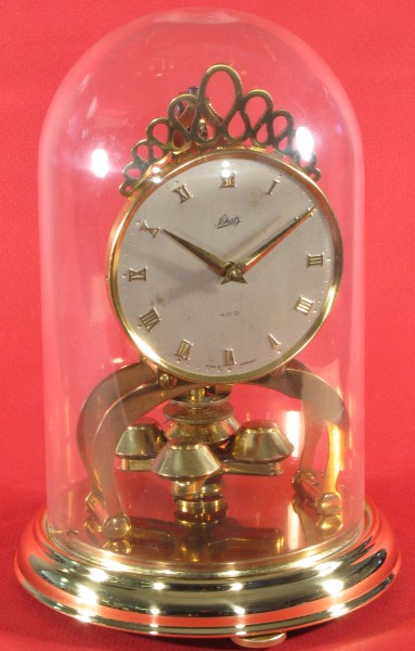Schatz miniature 400 day clock dated 5 56 (May 1956) on the movement. The dome is plastic with two locking pins.