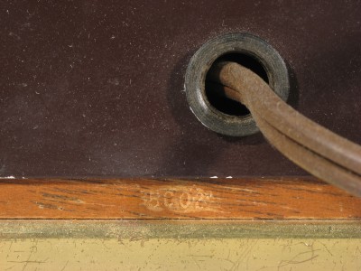 Date code 5002 on the wood beneath the power cord.