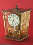 Kundo miniature 400 day clock, 8 1/ 4inches tall.
