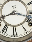 The painted dial with Waterbury Clock Co. trademark. Hour hand is original, minute hand has been replaced.