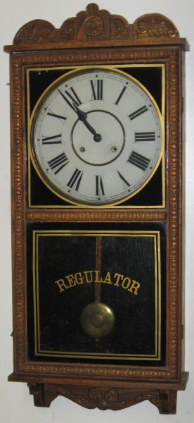 Waterbury "Crane" store regulator in oak case