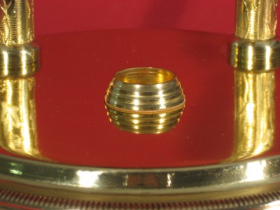 The scalloped base cup (it is smooth on most clocks)