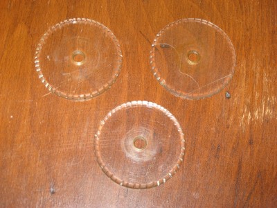 Clear leveling discs! Usually they are brass or plastic that looks like brass.