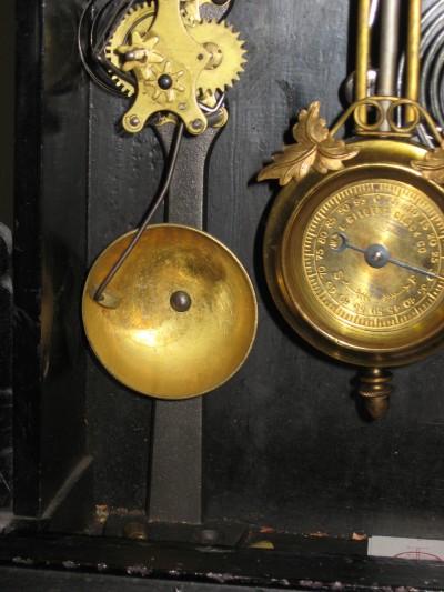 The alarm is mounted on a cast iron base
