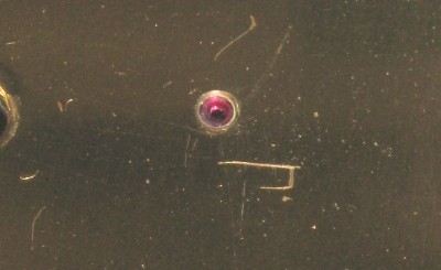 The jewel bearing in the front plate.
