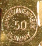 Rear plate of movement says "Jahresuhrenfabrik Germany 50" in a circle