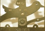 Closeup of back plate showing the date code 10 54 (Octover 1954).