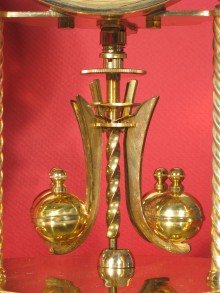 Later type of mounting nuts (short). Later type of pendulum (no slots in upper part of arms).