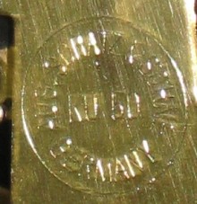 Rear plate of the movement says "Aug. Schatz & Sohne Germany KU 50" in a circle