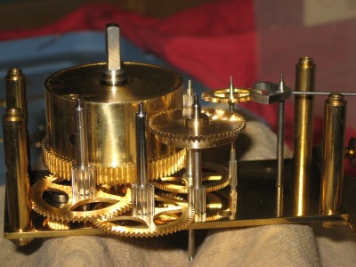 Side view of gears showing the auxiliary mainspring barrel (center).