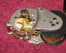 Back of motor showing the device that operates the power outage indicator.